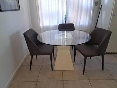 a dining table with two chairs and a glass table at 1 bedroom spacious apt in Beverly hills in Los Angeles