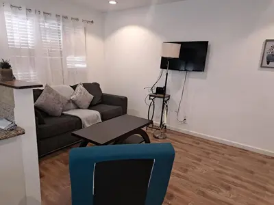 a living room with a couch and a table at Charming 1 bedroom apt in Beverly Hills in Los Angeles
