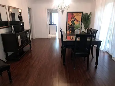 a living room with a dining room table and chairs at 3 bedroom plus 2 baths in Beverly hills in Los Angeles