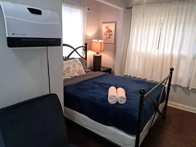 a bedroom with a bed with two slippers on it at 3 bedroom plus 2 baths in Beverly hills in Los Angeles