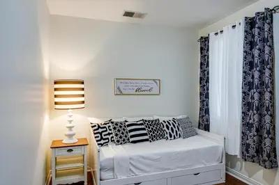 a small bedroom with a bed and a window at BBQ Ready Home 7 Mi to The Park at River Walk in Bakersfield