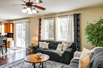 a living room with a couch and a table at BBQ Ready Home 7 Mi to The Park at River Walk in Bakersfield