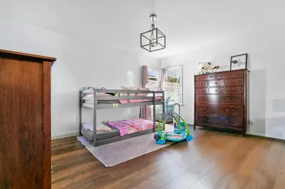 a bedroom with two bunk beds and a dresser at Luxury Pool Oasis- Near Stadium, Tennis and Golf in Pasadena