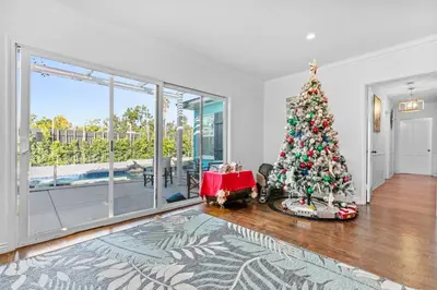 a christmas tree in the living room of a house at Luxury Pool Oasis- Near Stadium, Tennis and Golf in Pasadena