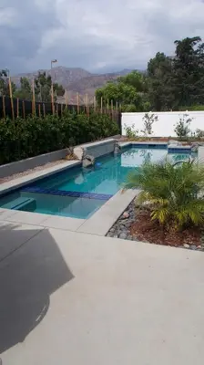 a swimming pool with blue water in a yard at Luxury Pool Oasis- Near Stadium, Tennis and Golf in Pasadena