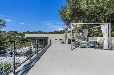 an outdoor patio with a canopy and chairs at Spacious 4BR Retreat with Private Pool, Pool Table and Fast Wi-Fi Sleeps 9 Quiet Clinton Location in Beverly Hills