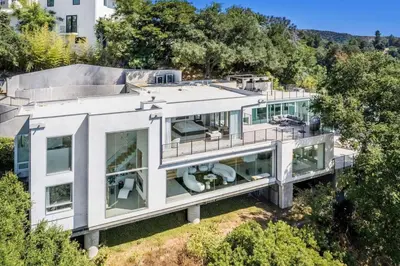 an aerial view of a house with glass at Spacious 4BR Retreat with Private Pool, Pool Table and Fast Wi-Fi Sleeps 9 Quiet Clinton Location in Beverly Hills
