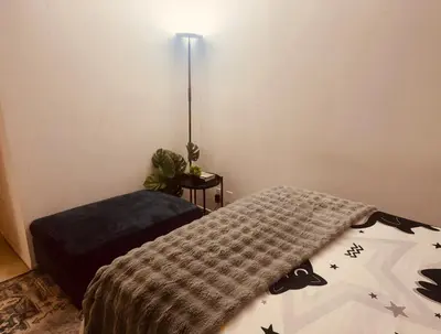 a bedroom with a bed and a lamp at Cozy beautiful 2 bedroom home at the beach in Los Angeles