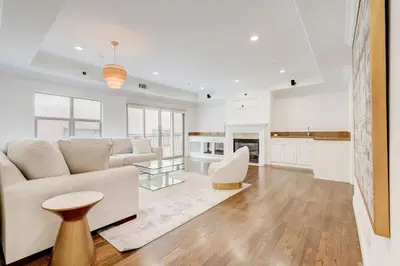 a white living room with a couch and a table at Los Angeles Beverly Hills Westside UCLA Luxury in Los Angeles