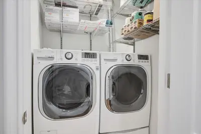 two washing machines are in a laundry room at Los Angeles Beverly Hills Westside UCLA Luxury in Los Angeles