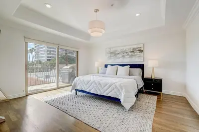 a bedroom with a bed and a large window at Los Angeles Beverly Hills Westside UCLA Luxury in Los Angeles