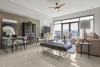 a living room with a couch and a table at Luxe DTLA Escape - Walk to Games, Events, & Dining in Los Angeles