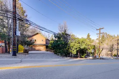 a house on the side of a street at Deer Creek Lodge Mtn Getaway in Lake Arrowhead! in Lake Arrowhead