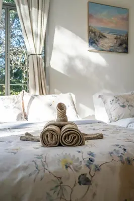 a coil of rope laying on a bed at Hillside Retreat Near Universal Studios & Hollywood Sign in Los Angeles
