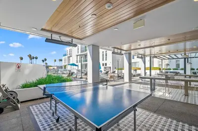 a ping pong table in the middle of a patio at Luxury Marina Penthouse Private Suite with Pool in Los Angeles