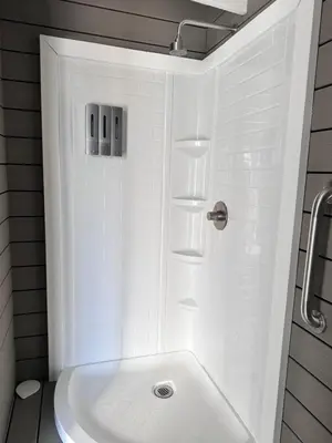 a white bathroom with a shower and a tub at Zaromelranch