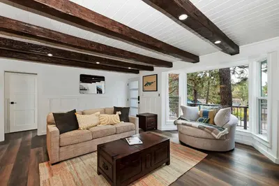 a living room with two couches and a coffee table at Highland Cedar Cabin WHot Tub Close to Village in Big Bear Lake