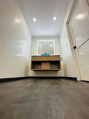 an empty room with a door and a table at Nubell Motel in Bell