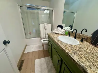 a bathroom with a sink and a toilet at Lakewood Timber Lodge Peaceful Private in Big Bear Lake