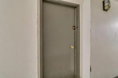 a door in a room with a white wall at Extended Stay in the Valley Gated and Convenient! in Tarzana