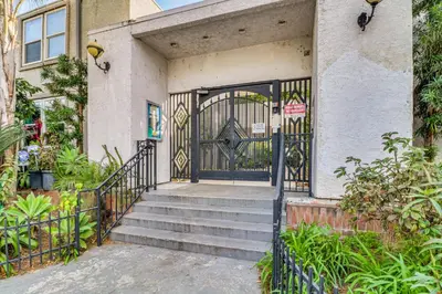 an entrance to a house with a gate and stairs at Extended Stay in the Valley Gated and Convenient! in Tarzana