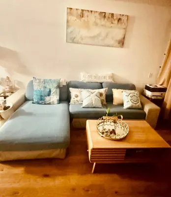 a living room with a couch and a coffee table at Cozy private room in Santa Monica in Los Angeles