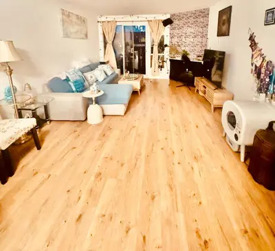 a living room with a hard wood floor at Cozy private room in Santa Monica in Los Angeles