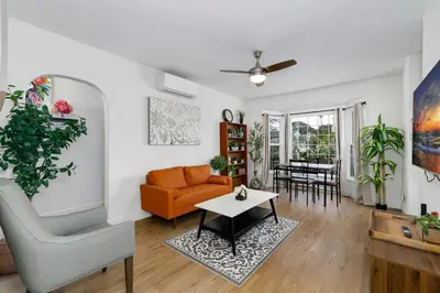 a living room with a couch and a table at Mar Vista Beach Escape 2BR with Relaxing Yard in Los Angeles