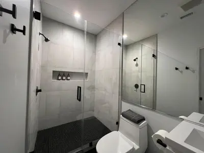 a bathroom with a shower with a toilet and a sink at Castaway Cay near Disney with Hot Tub and Fire Pit in Anaheim