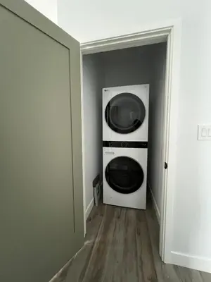a washer and dryer in a room with a door at Castaway Cay near Disney with Hot Tub and Fire Pit in Anaheim