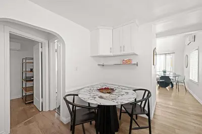 a kitchen and dining room with a table and chairs at Remodeled 1BR LA Apartment with full kitchen in Los Angeles