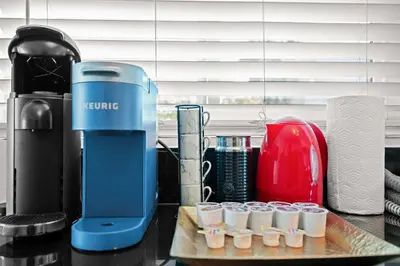 a blue juicer sitting on a counter next to cups at Remodeled 1BR LA Apartment with full kitchen in Los Angeles