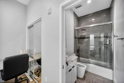 a bathroom with a toilet and a desk and a window at #01 Spacious 3B3B Near Koreatown & Hollywood, Central LA in Los Angeles