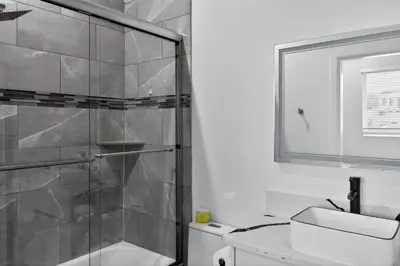 a bathroom with a glass shower and a sink at #01 Spacious 3B3B Near Koreatown & Hollywood, Central LA in Los Angeles