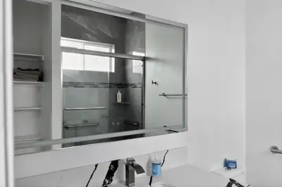 a mirror over a sink in a bathroom at #01 Spacious 3B3B Near Koreatown & Hollywood, Central LA in Los Angeles