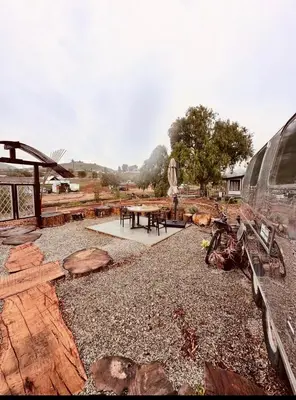 a picnic area with a table and a van at Zaromelranch