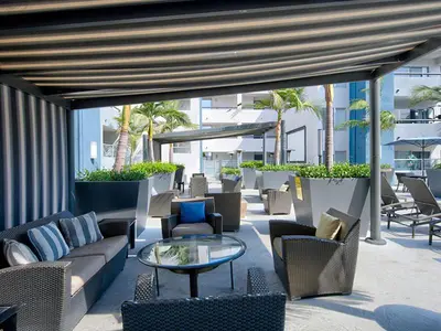 a patio with couches and chairs and a table at ENSUITE MASTER BEDROOM IN WEST HOLLYWOOD - super host in Los Angeles
