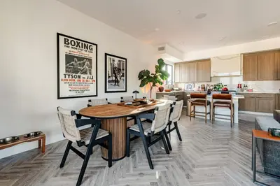 a kitchen and living room with a table and chairs at Abracadabra Ultra Luxury Private Residence in Los Angeles