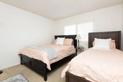 a bedroom with two beds and a window at Cozy 2BR Near Disneyland and Convention Center in Anaheim