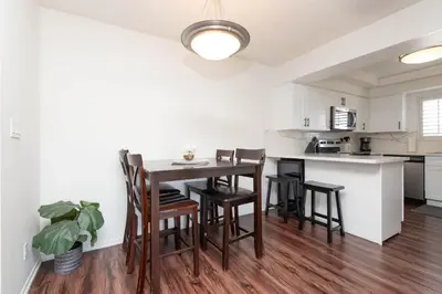 a kitchen with a table and chairs in a room at Cozy 2BR Near Disneyland and Convention Center in Anaheim