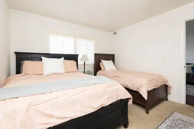 a bedroom with two beds and a window at Cozy 2BR Near Disneyland and Convention Center in Anaheim