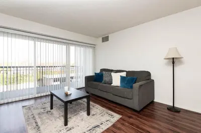 a living room with a couch and a table at Cozy 2BR Near Disneyland and Convention Center in Anaheim