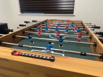 a group of toy people in a pool table at Brick & Breeze in Bakersfield