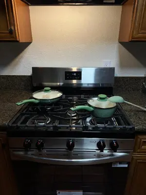 a stove with two frying pans on top of it at Brick & Breeze in Bakersfield
