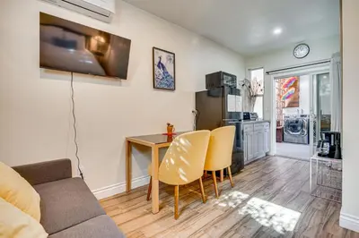 a living room with a couch and a table and chairs at 4 Mi to Old Pasadena! Well-Appointed Studio Stay in Pasadena