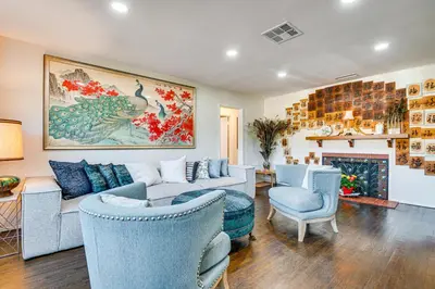 a living room with a couch and chairs and a fireplace at Peacock House Sanctuary 4 Mi to Old Pasadena! in Pasadena