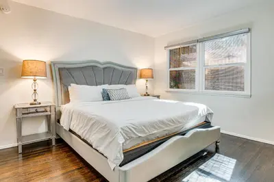 a white bedroom with a bed and a window at Peacock House Sanctuary 4 Mi to Old Pasadena! in Pasadena