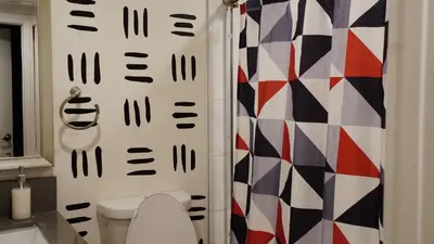 a bathroom with a toilet and a shower at Paradise in LA near LAX and SoFi Stadium in Los Angeles