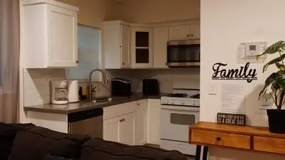 a kitchen with white cabinets and a counter top at Paradise in LA near LAX and SoFi Stadium in Los Angeles