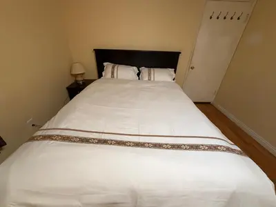 a large white bed in a small bedroom at Citrus Loft Room B - Quiet and Convenience Female Only in Covina